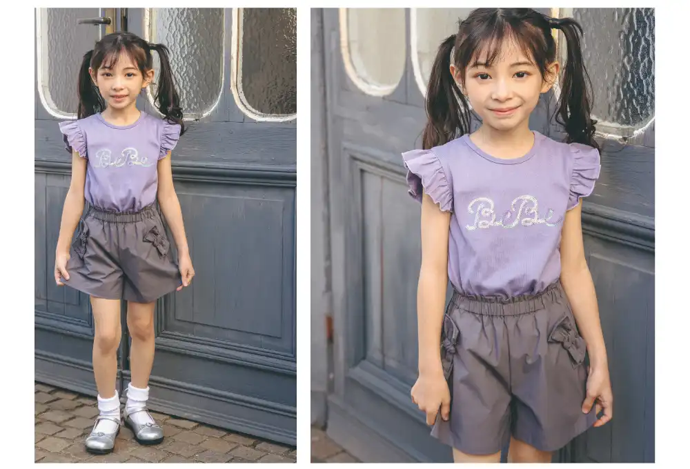 パープルのTシャツを着た女の子